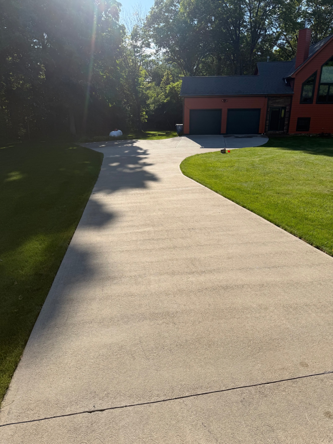 Freshly pressure-washed concrete driveway