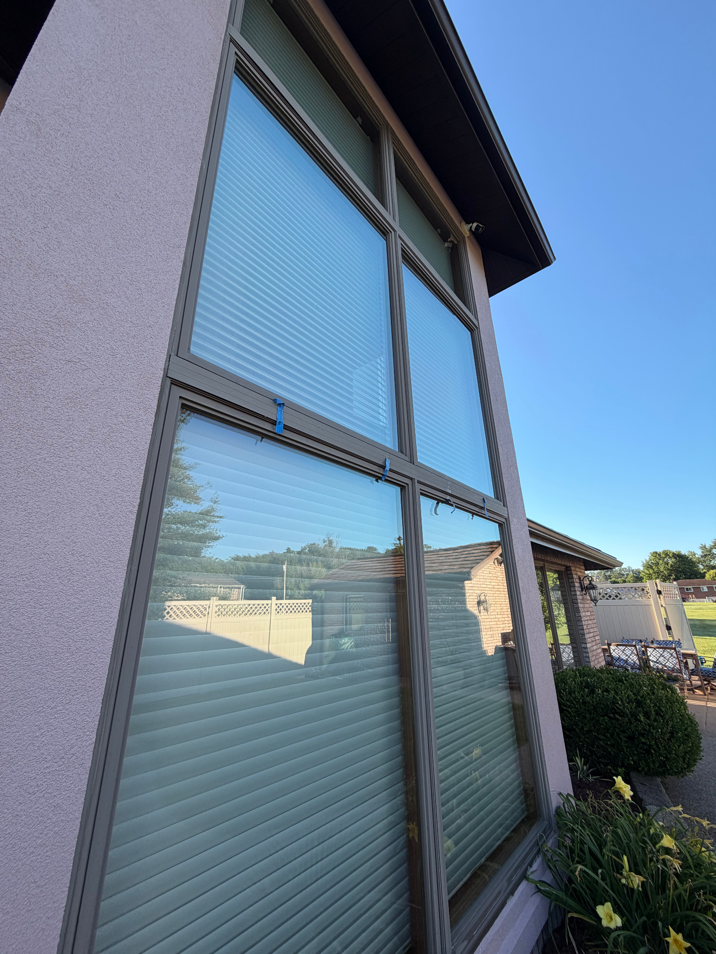 Tall exterior windows cleaned to a spotless shine